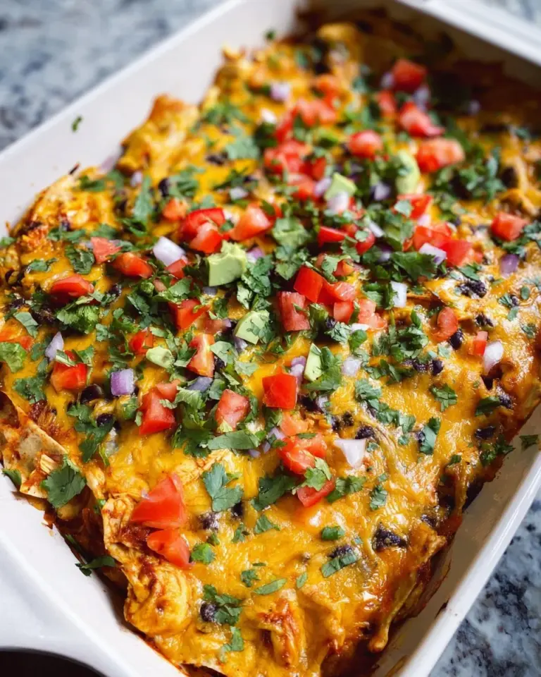 Hearty Chicken Enchilada Casserole topped with cheese and fresh cilantro