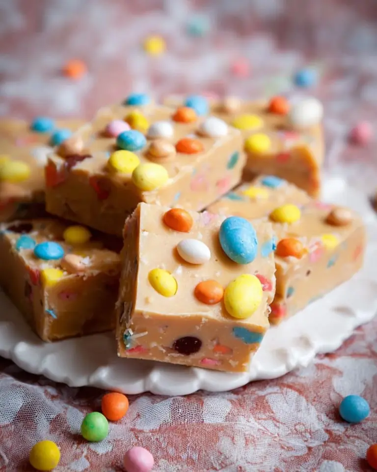 Delicious homemade Easter fudge arranged in colorful squares on a festive plate
