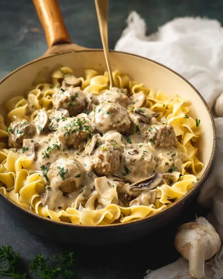 Delicious Meatball Stroganoff served with creamy sauce over pasta