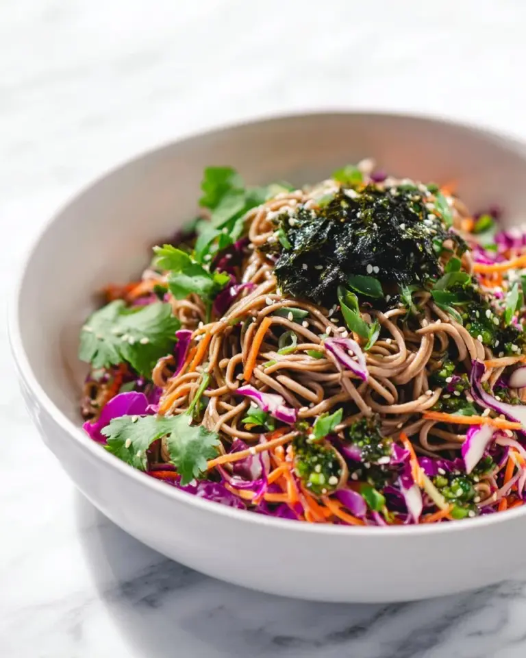 Refreshing cold soba noodle salad topped with fresh vegetables and sesame dressing