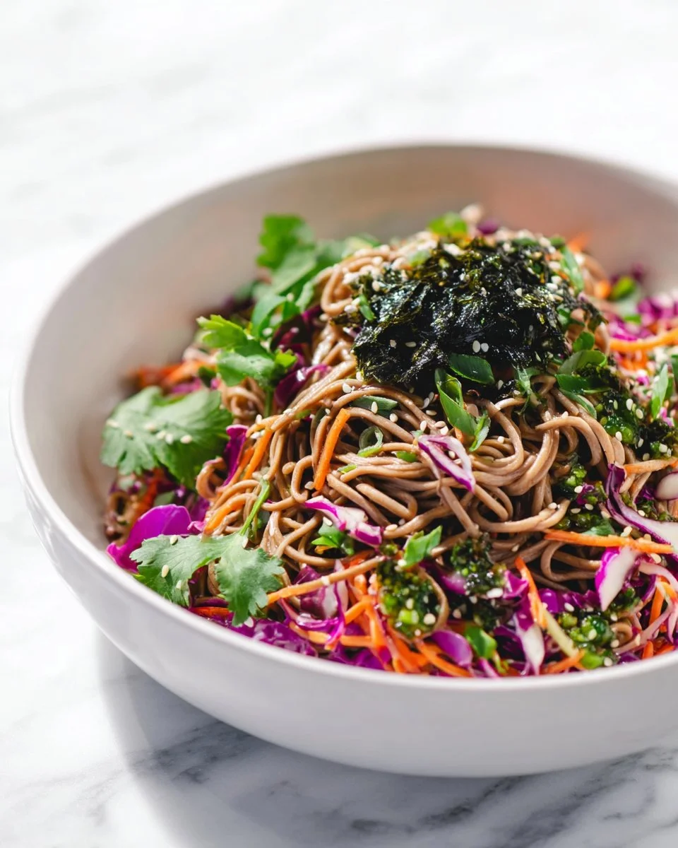 Refreshing cold soba noodle salad topped with fresh vegetables and sesame dressing