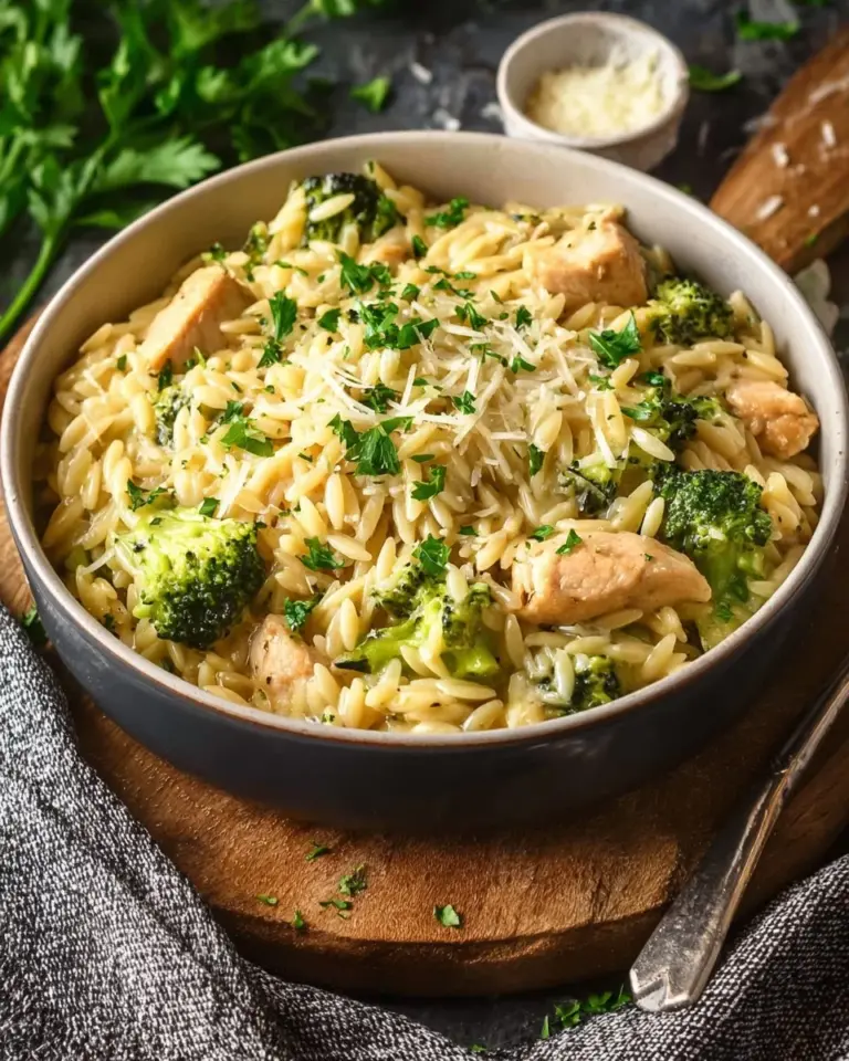 Delicious Cheesy Chicken Broccoli Orzo in a creamy sauce with chicken and vegetables