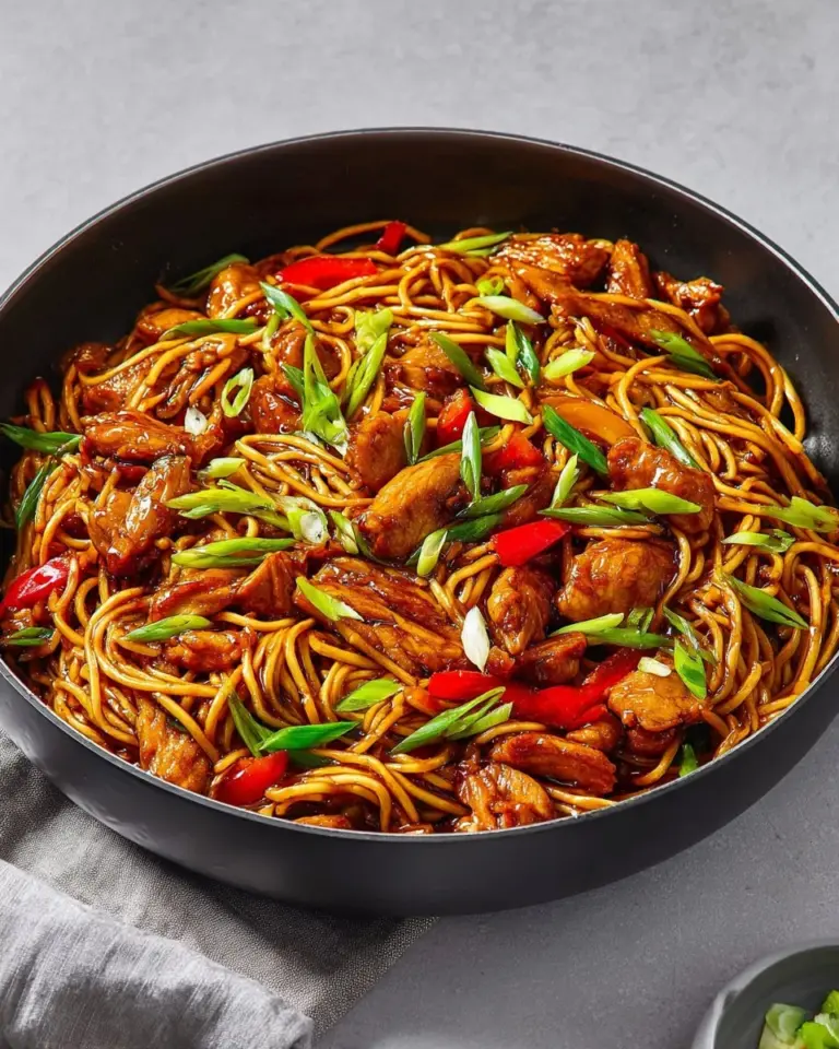 Hoisin chicken served with noodles in a vibrant dish