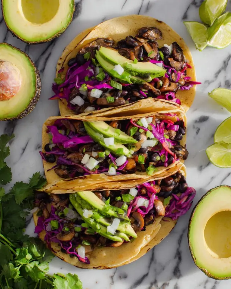 Delicious black bean mushroom tacos garnished with fresh toppings