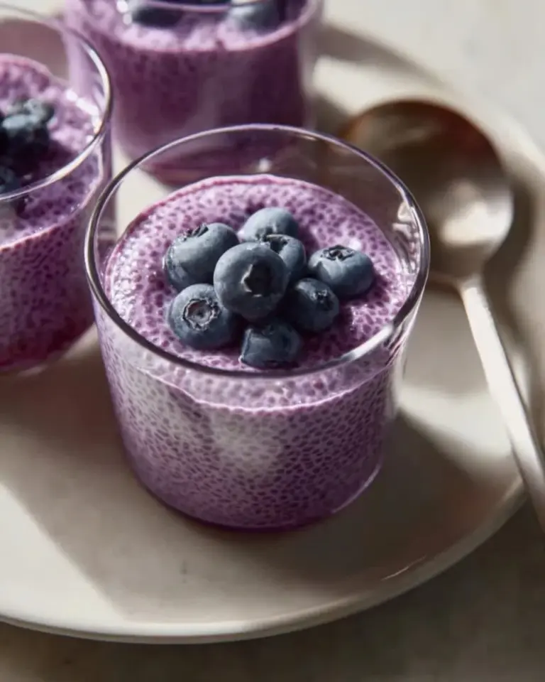 Blueberry Chia Seed Pudding topped with fresh blueberries and mint leaves