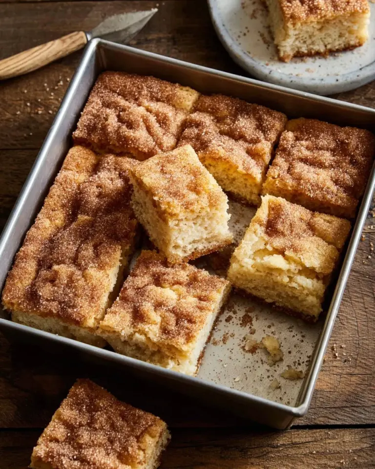 Fluffy cinnamon sugar butter swim biscuits served on a rustic plate