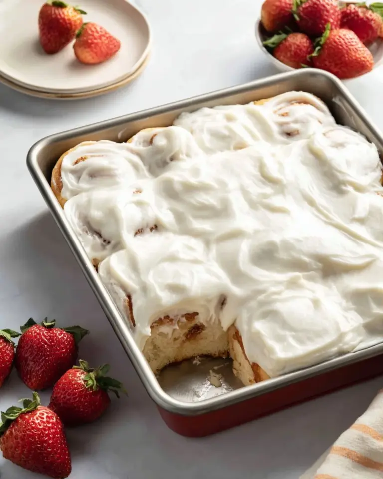 Delicious strawberries and cream sweet rolls served on a plate